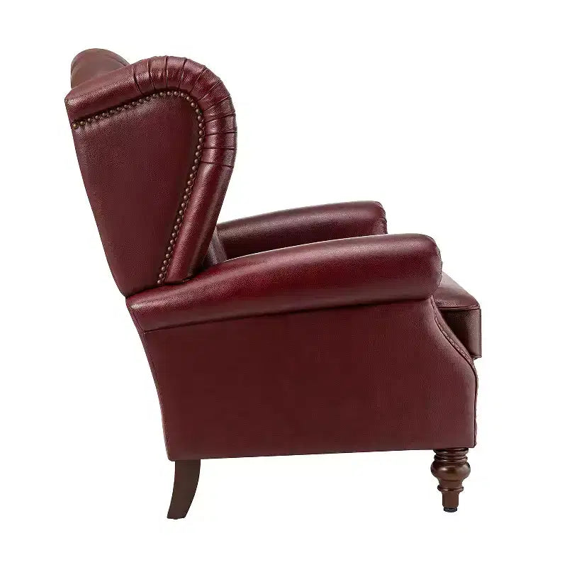 Poltrona a pozzetto Amanda 33, ampia, in vera pelle con gambe coniche in legno massiccio e bordo con borchie | ART OF LIVING DESIGNS