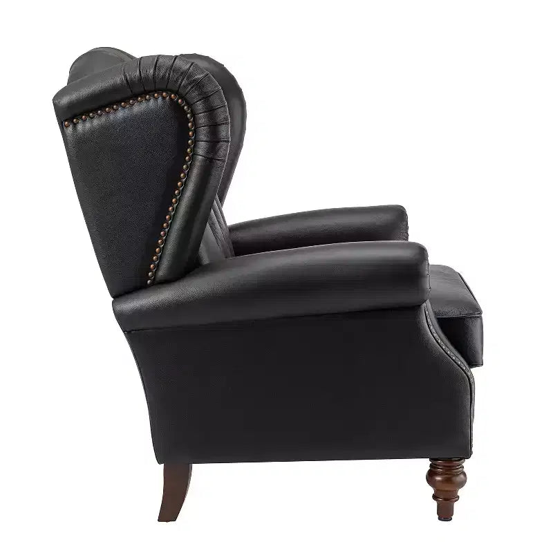 Poltrona a pozzetto Amanda 33, ampia, in vera pelle con gambe coniche in legno massiccio e bordo con borchie | ART OF LIVING DESIGNS