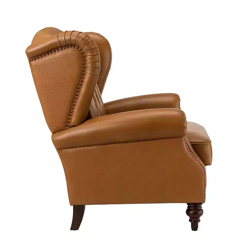 Poltrona a pozzetto Amanda 33, ampia, in vera pelle con gambe coniche in legno massiccio e bordo con borchie | ART OF LIVING DESIGNS