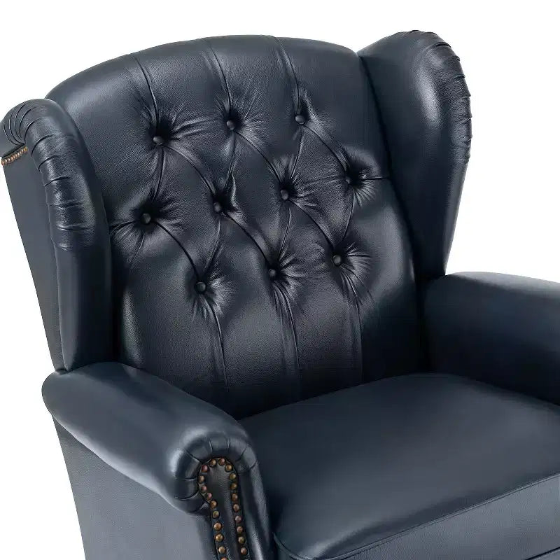 Poltrona a pozzetto Amanda 33, ampia, in vera pelle con gambe coniche in legno massiccio e bordo con borchie | ART OF LIVING DESIGNS